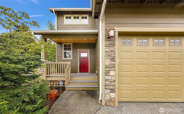 view of exterior entry with a garage