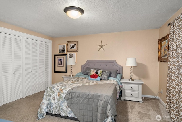 carpeted bedroom featuring a textured ceiling and baseboards