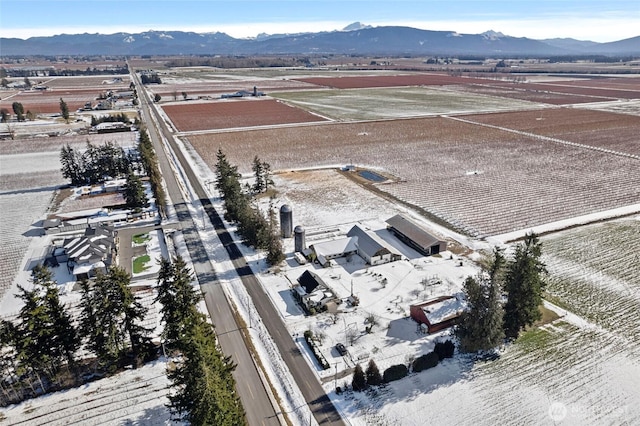 birds eye view of property with a mountain view