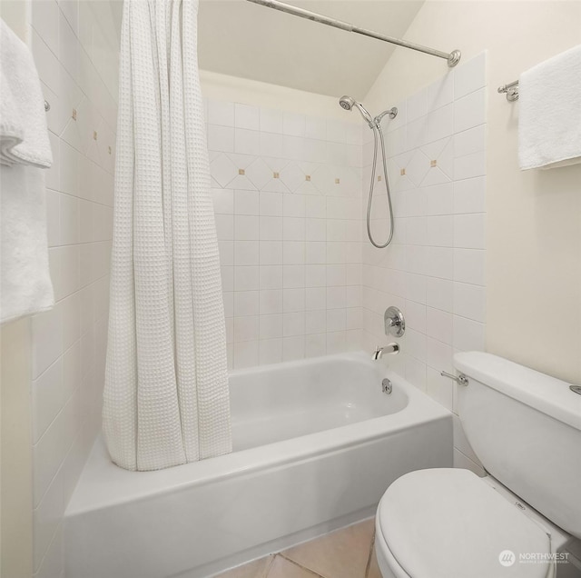 bathroom featuring tile patterned floors, toilet, and shower / bath combo