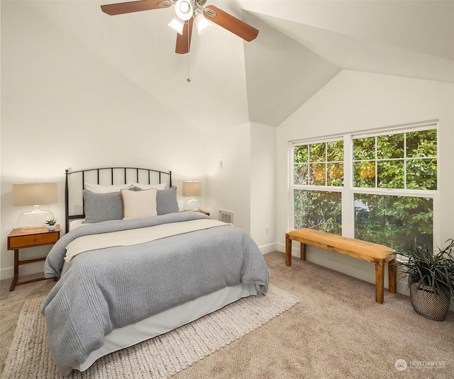 carpeted bedroom featuring lofted ceiling and ceiling fan