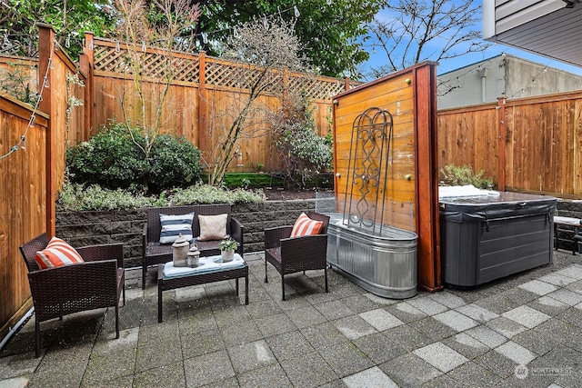 view of patio with a hot tub