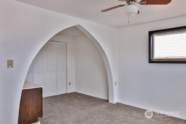 bonus room featuring carpet and ceiling fan