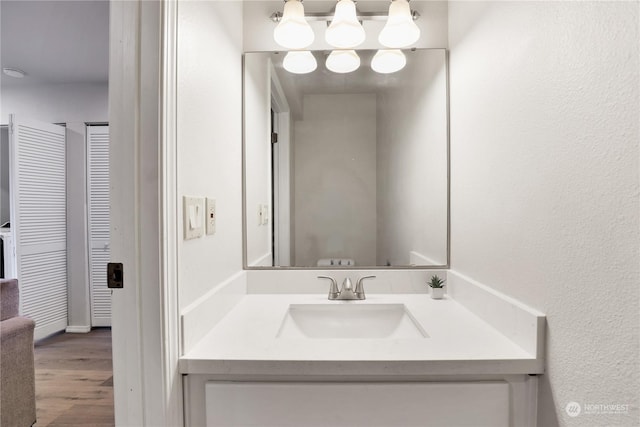 bathroom featuring vanity and wood-type flooring