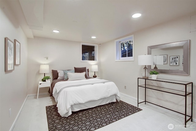 bedroom with recessed lighting, light colored carpet, and baseboards