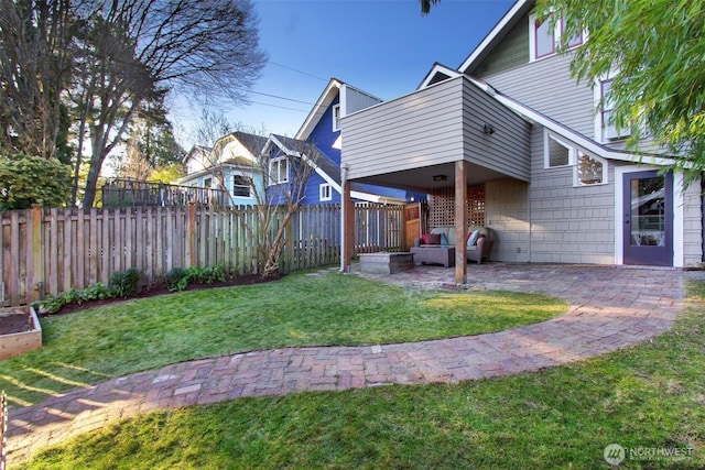 view of yard featuring a fenced backyard and a patio