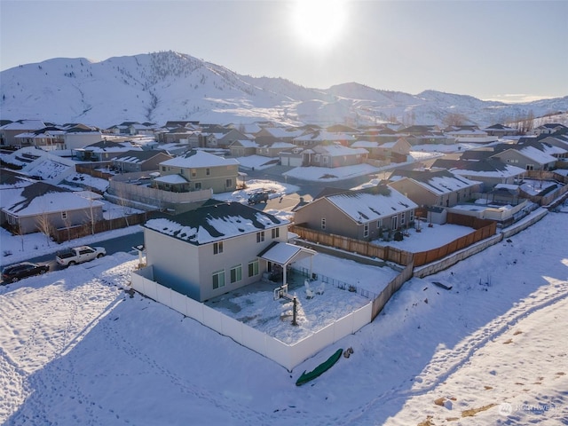 snowy aerial view featuring a mountain view