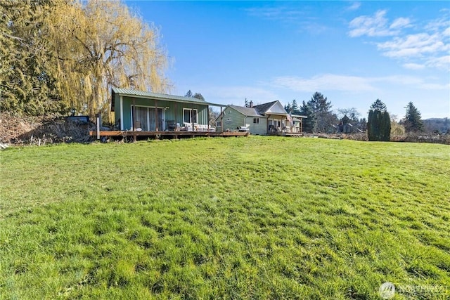 view of yard with a deck