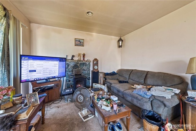 living room featuring carpet floors and a fireplace