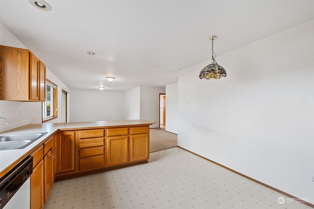 kitchen featuring hanging light fixtures, sink, stainless steel dishwasher, and kitchen peninsula