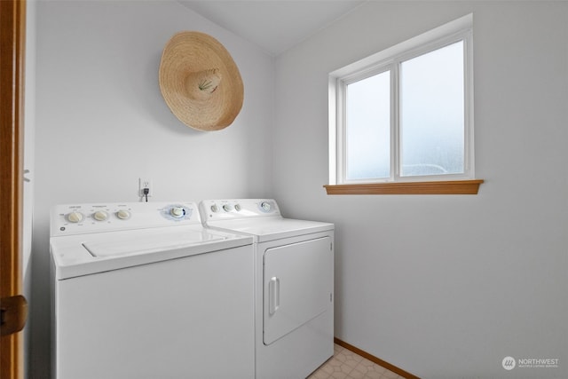 laundry area with washing machine and clothes dryer