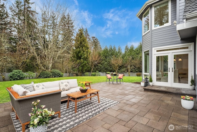 view of patio with a fenced backyard, an outdoor hangout area, and french doors