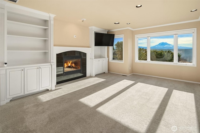 unfurnished living room with plenty of natural light, a fireplace, and baseboards