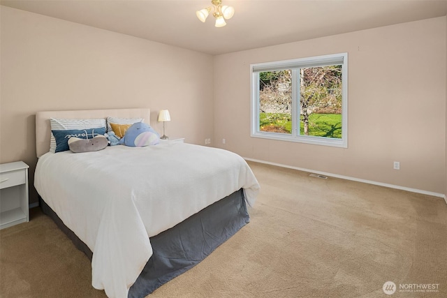 bedroom featuring visible vents, baseboards, and carpet flooring