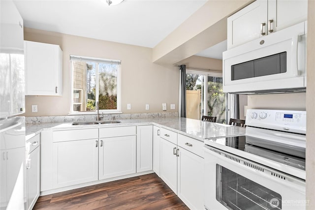 kitchen featuring sink, white appliances, white cabinetry, dark hardwood / wood-style floors, and light stone counters