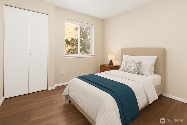 3350 NW Ave Unit 102, Bellingham, WA 98225 - bedroom featuring wood finished floors, baseboards, and a closet