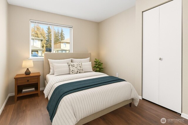 3350 NW Ave Unit 102, Bellingham, WA 98225 - bedroom with wood finished floors, baseboards, and a closet