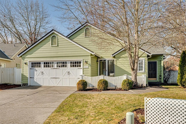 view of front facade with a garage and a front lawn