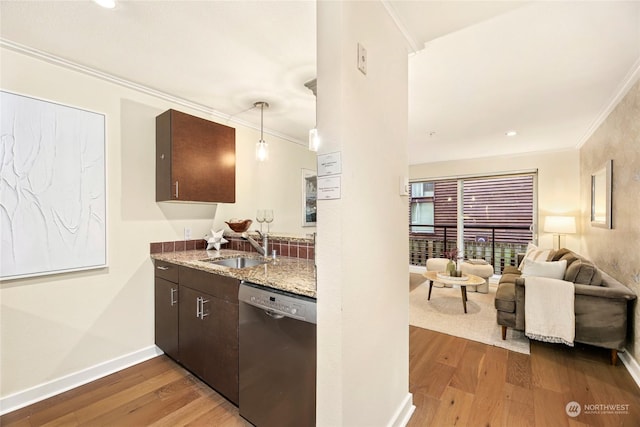 kitchen featuring decorative light fixtures, sink, stainless steel dishwasher, crown molding, and dark brown cabinets