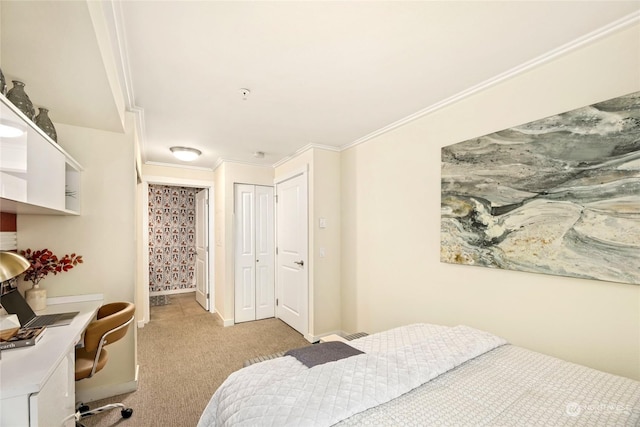 carpeted bedroom with ornamental molding and a closet