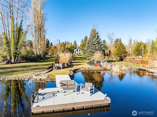 dock area featuring a water view and a yard