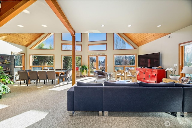 living room with high vaulted ceiling, beam ceiling, carpet flooring, and wooden ceiling