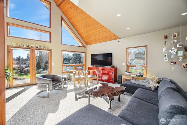 living room with carpet, high vaulted ceiling, and recessed lighting