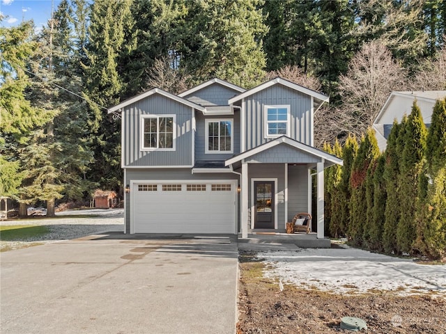 view of front of home with a garage and covered porch