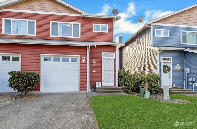 view of front of property with a garage and a front yard