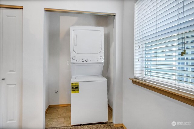 washroom with stacked washer / dryer