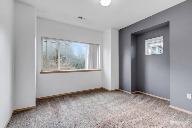 empty room with carpet flooring