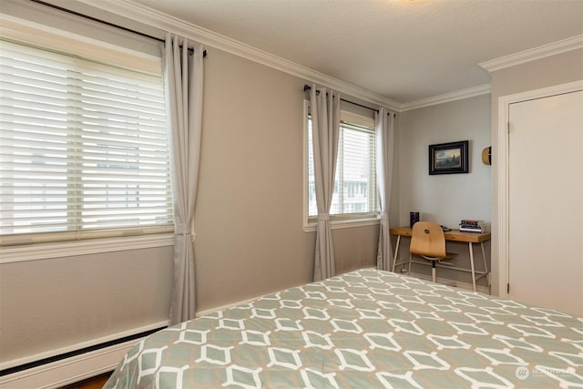 bedroom with ornamental molding and a baseboard heating unit