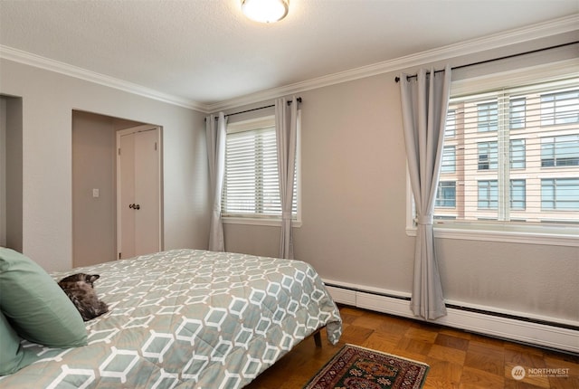 bedroom with a baseboard radiator, parquet flooring, a textured ceiling, and crown molding