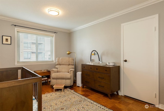 bedroom with crown molding, parquet flooring, and a nursery area