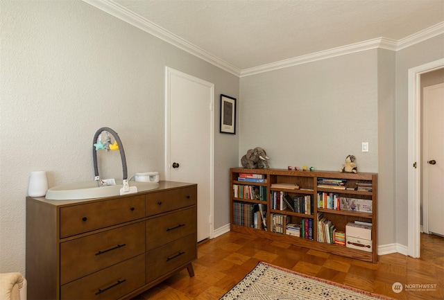 interior space with crown molding, parquet flooring, and vanity