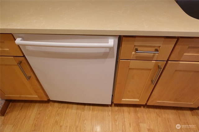 details featuring white dishwasher and light wood-type flooring