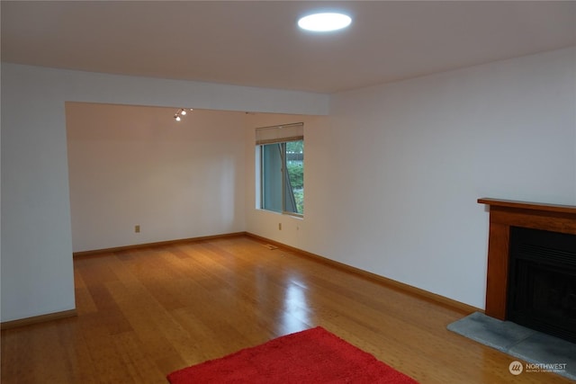 unfurnished living room with light hardwood / wood-style floors