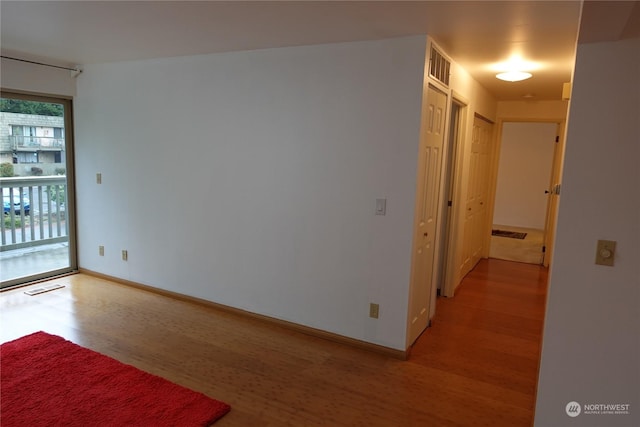 spare room featuring hardwood / wood-style floors