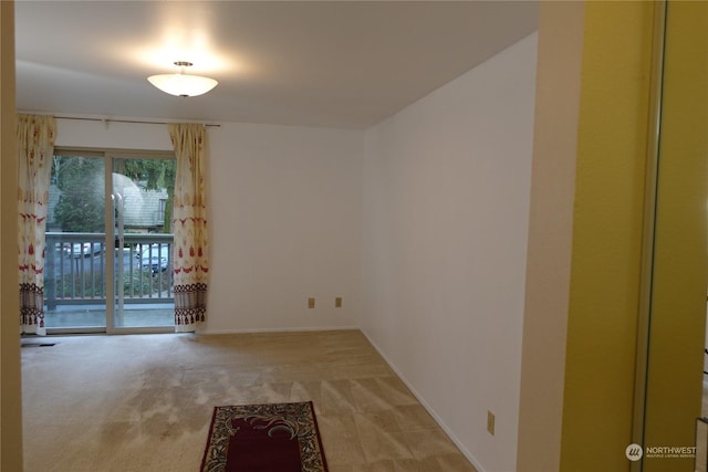 empty room featuring carpet flooring