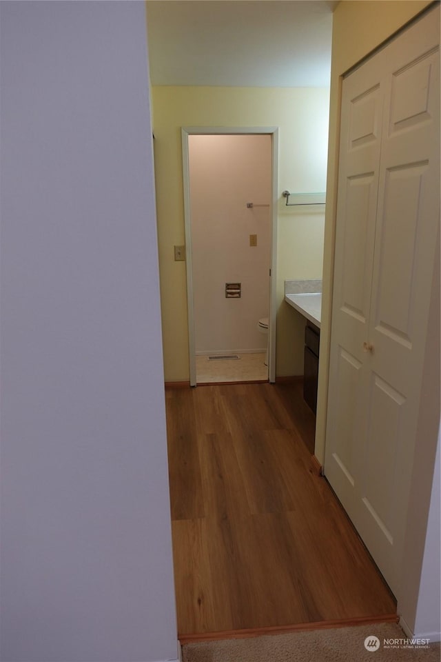 corridor featuring light hardwood / wood-style flooring