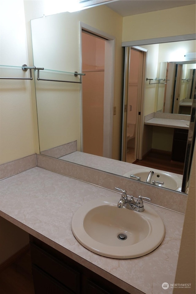 bathroom with vanity and toilet