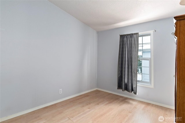 unfurnished room featuring light hardwood / wood-style floors