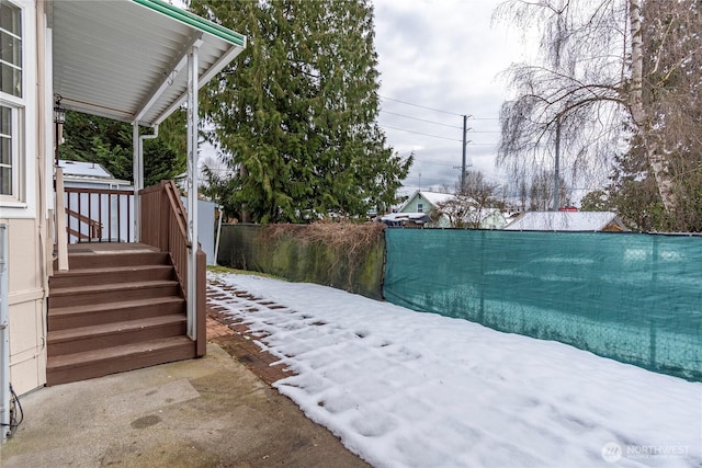 view of yard covered in snow