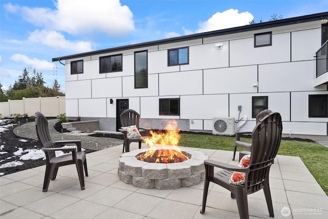 view of patio / terrace with ac unit and an outdoor fire pit