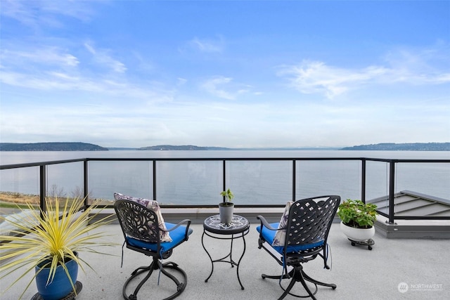 balcony featuring a water view