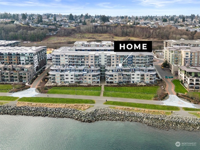 birds eye view of property with a water view