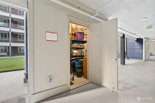 interior space with a textured ceiling