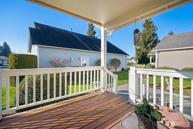 wooden terrace featuring covered porch