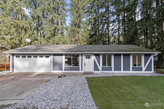 ranch-style home with a garage and a front yard