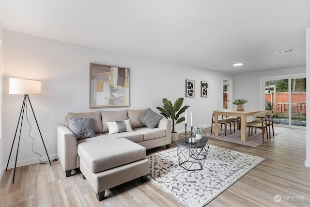 living room featuring light wood-type flooring